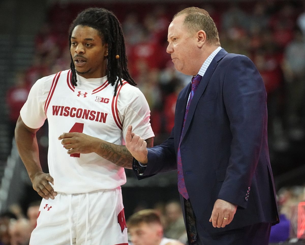 Wisconsin guard Kamari McGee (4) listens to head coach Gard during the first half of their game agains Western Illinois Monday, November 27, 2023 at the Kohl Center in Madison, Wisconsin.Mark Hoffman/Milwaukee Journal Sentinel