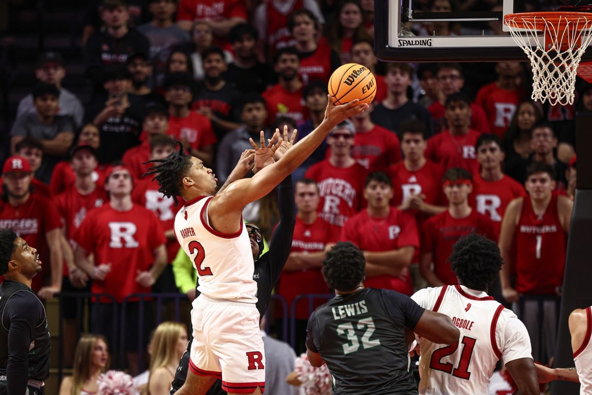 Nov 6, 2024; Piscataway, New Jersey, USA; Rutgers Scarlet Knights guard Dylan Harper (2) drives to the basket against Wagner Seahawks guard R.J. Greene (10) during the first half at Jersey Mike's Arena. Mandatory Credit: Vincent Carchietta-Imagn Images