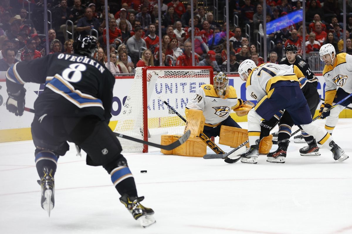 Nov 6, 2024; Washington, District of Columbia, USA; Washington Capitals left wing Alex Ovechkin (8) prepares to shoot the puck on Nashville Predators goaltender Juuse Saros (74) in the first period at Capital One Arena. Mandatory Credit: Geoff Burke-Imagn Images