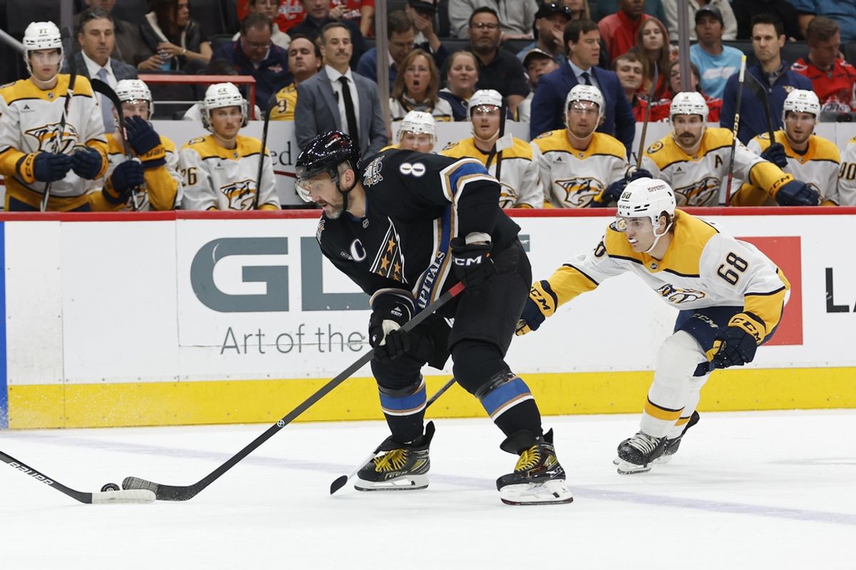 Nov 6, 2024; Washington, District of Columbia, USA; Washington Capitals left wing Alex Ovechkin (8) skates with the puck as Nashville Predators left wing Zachary L'Heureux (68) chases in the first period at Capital One Arena. Mandatory Credit: Geoff Burke-Imagn Images