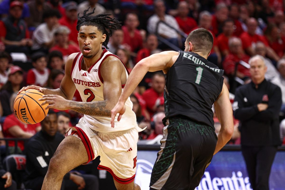 Nov 6, 2024; Piscataway, New Jersey, USA; Rutgers Scarlet Knights guard Dylan Harper (2) dribbles against Wagner Seahawks guard Javier Ezquerra (1) during the second half at Jersey Mike's Arena. Mandatory Credit: Vincent Carchietta-Imagn Images