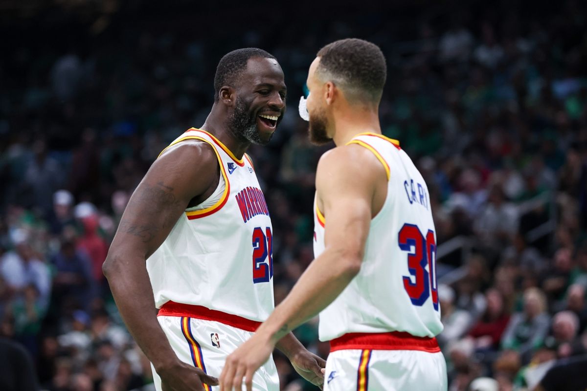 Nov 6, 2024; Boston, Massachusetts, USA; Golden State Warriors forward Draymond Green (23) and Golden State Warriors guard Stephen Curry (30) celebrate during the first half against the Boston Celtics at TD Garden. Mandatory Credit: Paul Rutherford-Imagn Images