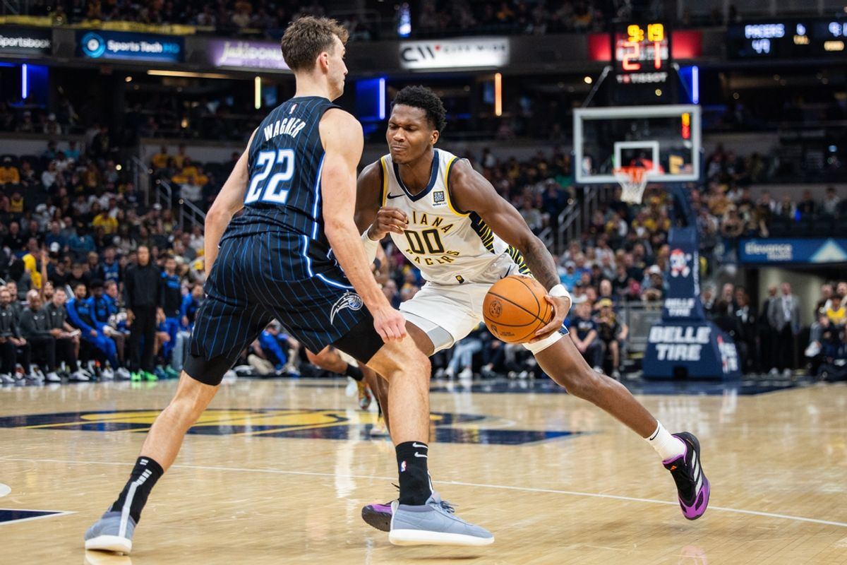 Nov 6, 2024; Indianapolis, Indiana, USA; Indiana Pacers guard Bennedict Mathurin (00) dribbles the ball while Orlando Magic forward Franz Wagner (22) defends in the first half at Gainbridge Fieldhouse. Mandatory Credit: Trevor Ruszkowski-Imagn Images