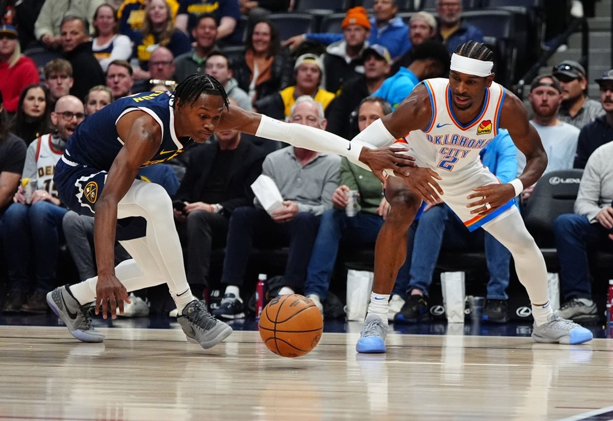 Nov 6, 2024; Denver, Colorado, USA; Denver Nuggets forward Peyton Watson (8) and Oklahoma City Thunder guard Shai Gilgeous-Alexander (2) reach for a loose ball in the first quarter at Ball Arena. Mandatory Credit: Ron Chenoy-Imagn Images