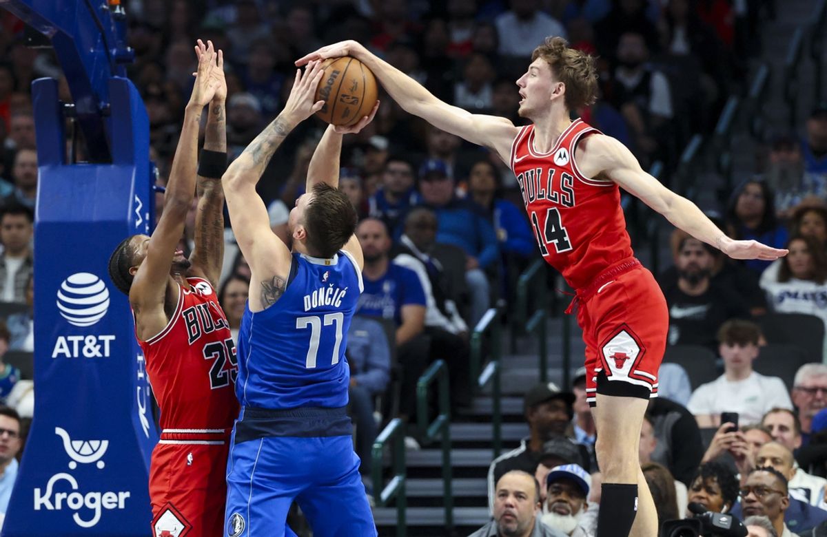 Nov 6, 2024; Dallas, Texas, USA;  Chicago Bulls forward Matas Buzelis (14) blocks the shot of Dallas Mavericks guard Luka Doncic (77) during the first half at American Airlines Center. Mandatory Credit: Kevin Jairaj-Imagn Images