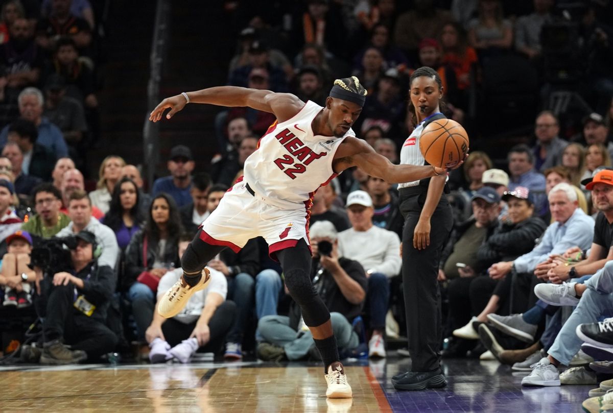 Nov 6, 2024; Phoenix, Arizona, USA; Miami Heat forward Jimmy Butler (22) saves the ball against the Phoenix Suns during the first half at Footprint Center. Mandatory Credit: Joe Camporeale-Imagn Images