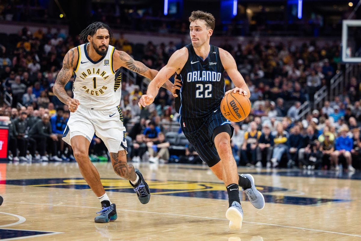 Nov 6, 2024; Indianapolis, Indiana, USA; Orlando Magic forward Franz Wagner (22) dribbles the ball while Indiana Pacers forward Obi Toppin (1) defends in the second half at Gainbridge Fieldhouse. Mandatory Credit: Trevor Ruszkowski-Imagn Images