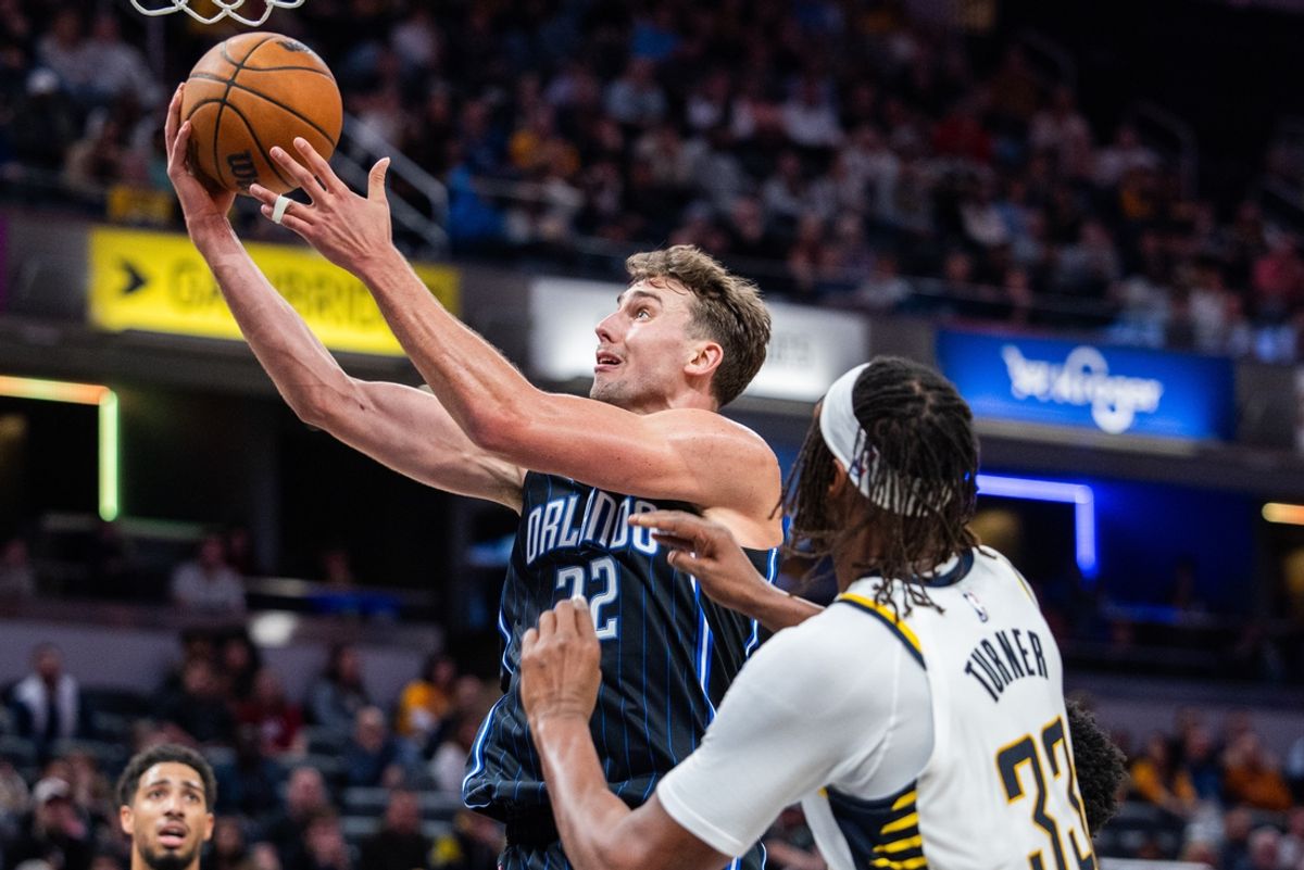 Nov 6, 2024; Indianapolis, Indiana, USA; Orlando Magic forward Franz Wagner (22) shoots the ball while Indiana Pacers center Myles Turner (33) defends in the second half at Gainbridge Fieldhouse. Mandatory Credit: Trevor Ruszkowski-Imagn Images