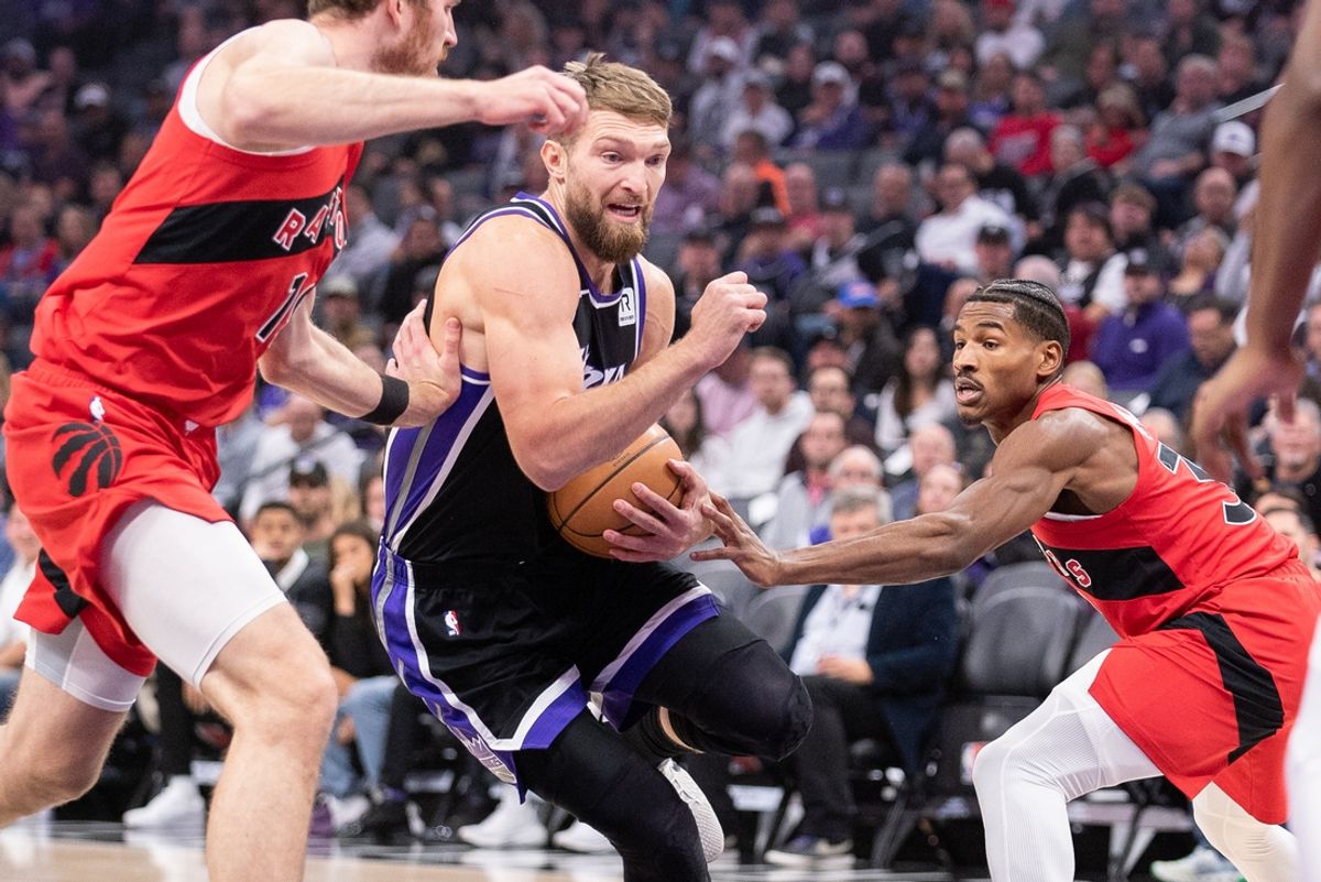 Nov 6, 2024; Sacramento, California, USA; Sacramento Kings forward Domantas Sabonis (11) drives to the basket against the Toronto Raptors during the first quarter at Golden 1 Center. Mandatory Credit: Ed Szczepanski-Imagn Images