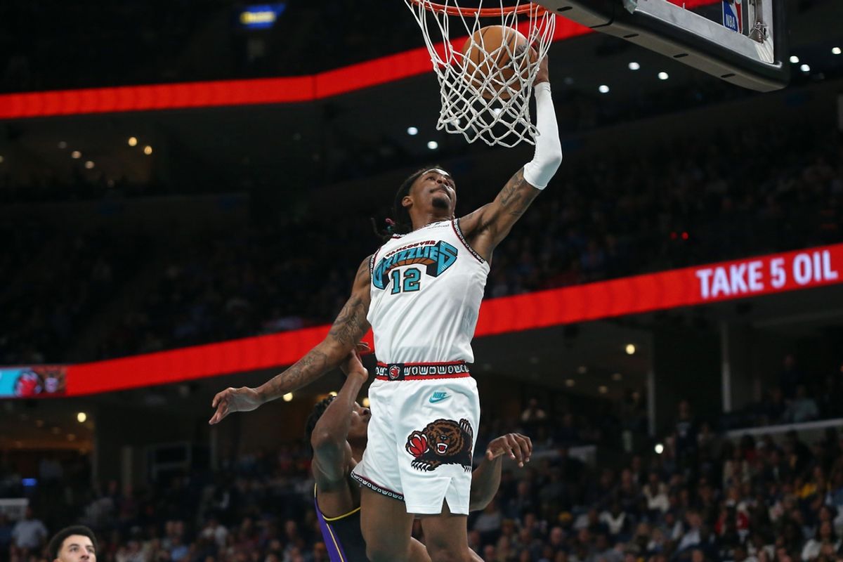 Nov 6, 2024; Memphis, Tennessee, USA; Memphis Grizzlies guard Ja Morant (12) drives to the basket during the second half against the Los Angeles Lakers at FedExForum. Mandatory Credit: Petre Thomas-Imagn Images