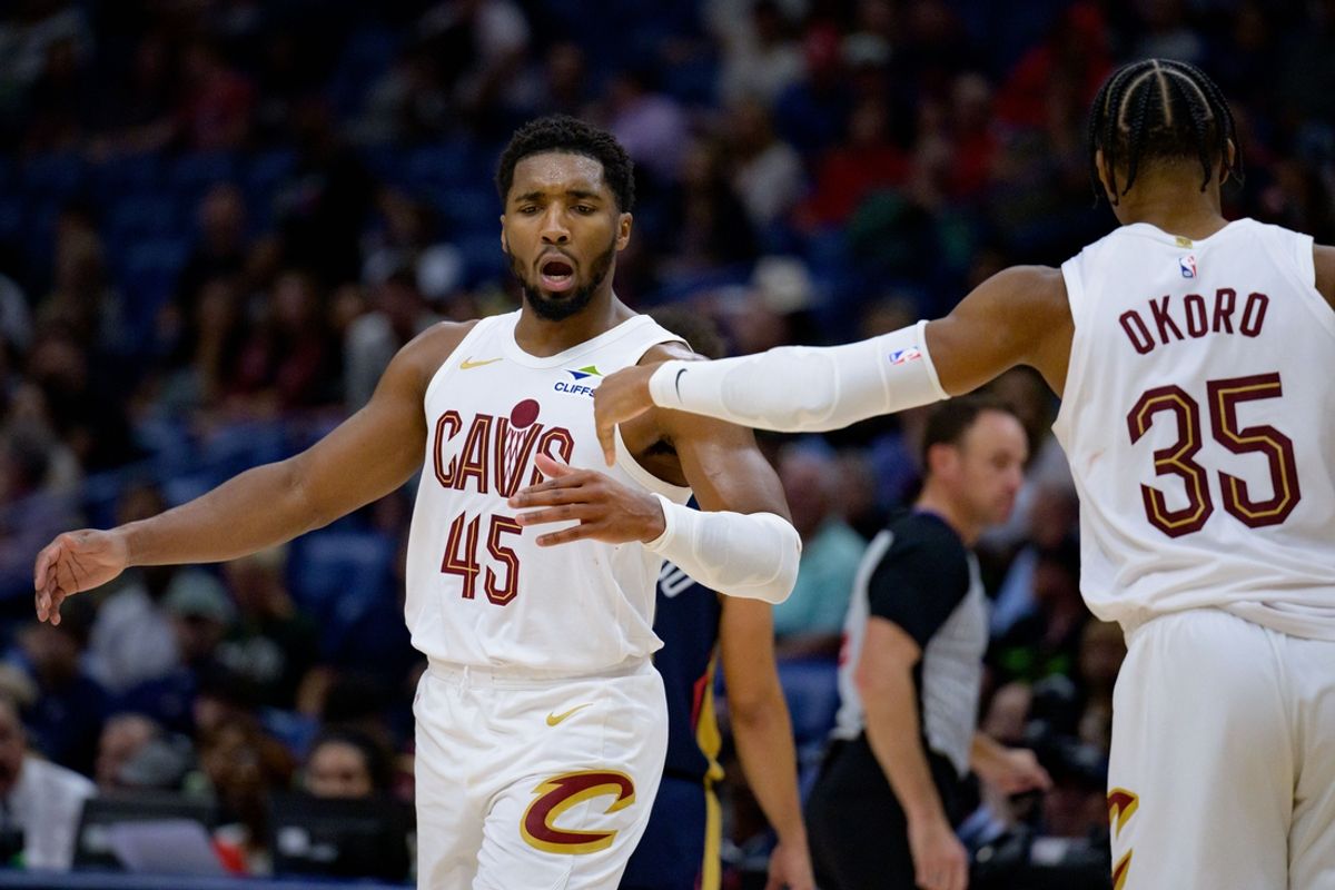 Nov 6, 2024; New Orleans, Louisiana, USA; Cleveland Cavaliers guard Donovan Mitchell (45) celebrates with Cleveland Cavaliers forward Isaac Okoro (35) during the fourth quarter at Smoothie King Center. Mandatory Credit: Matthew Hinton-Imagn Images