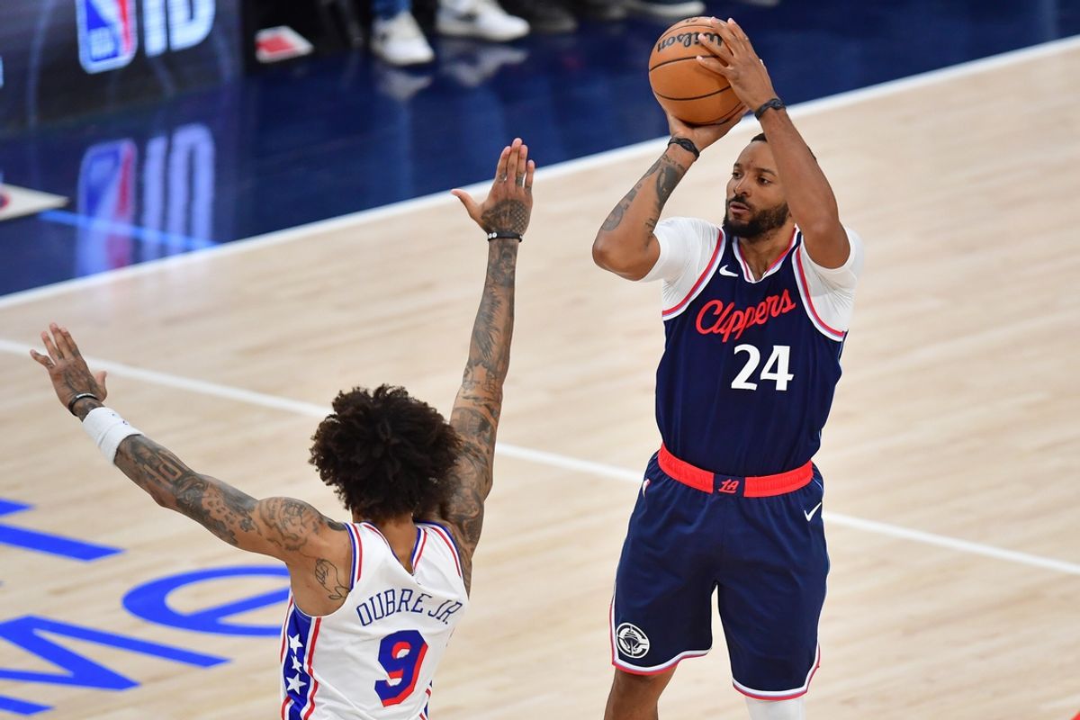 Nov 6, 2024; Inglewood, California, USA; Los Angeles Clippers guard Norman Powell (24) shoots against Philadelphia 76ers guard Kelly Oubre Jr. (9) during the first half at Intuit Dome. Mandatory Credit: Gary A. Vasquez-Imagn Images