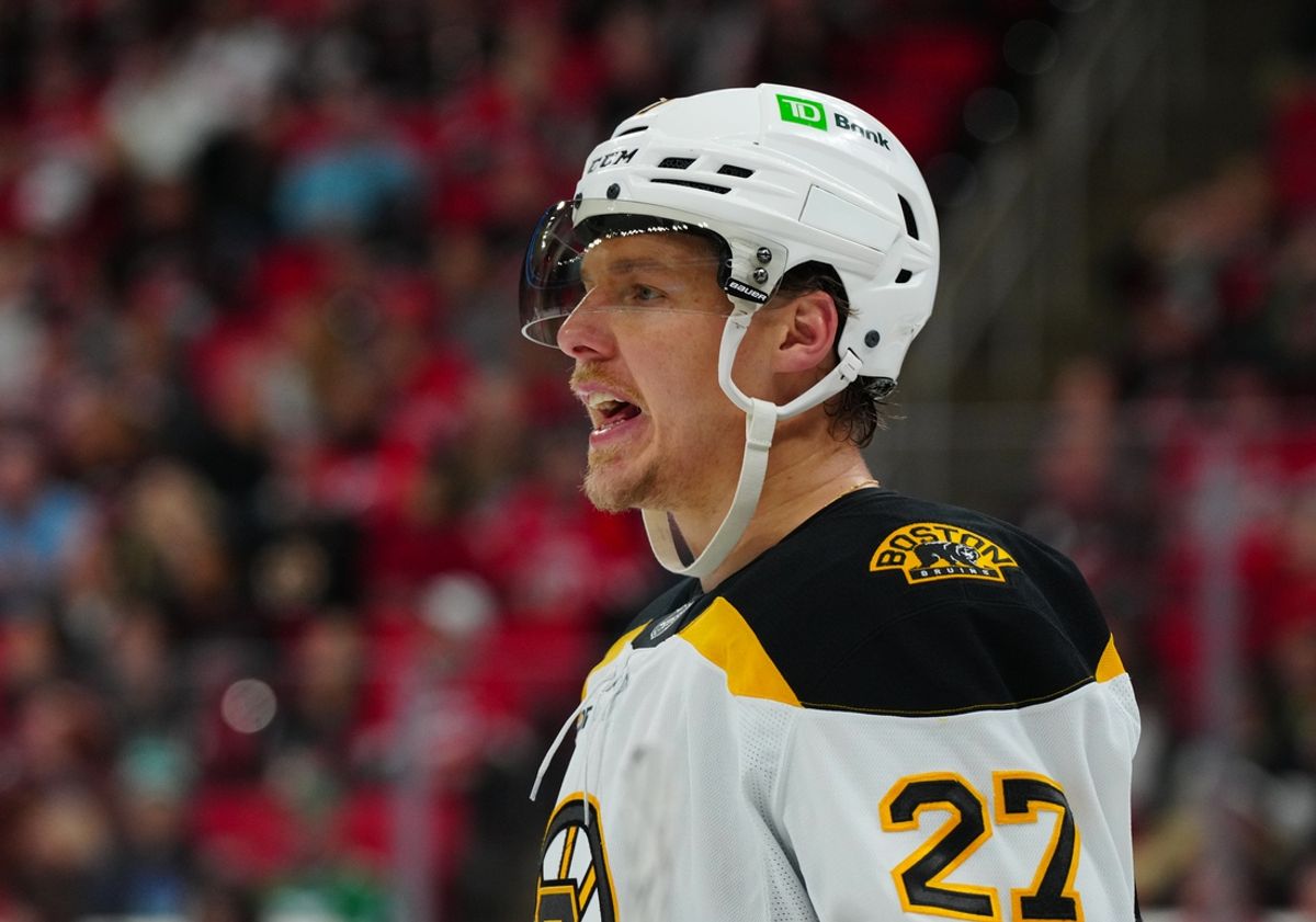 Oct 31, 2024; Raleigh, North Carolina, USA;  Boston Bruins defenseman Hampus Lindholm (27) reacts against the Carolina Hurricanes during the third period at Lenovo Center. Mandatory Credit: James Guillory-Imagn Images