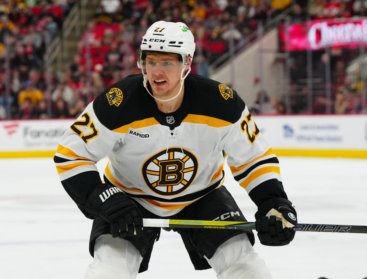 Oct 31, 2024; Raleigh, North Carolina, USA;  Boston Bruins defenseman Hampus Lindholm (27) skates against the Carolina Hurricanes during the third period at Lenovo Center. Mandatory Credit: James Guillory-Imagn Images