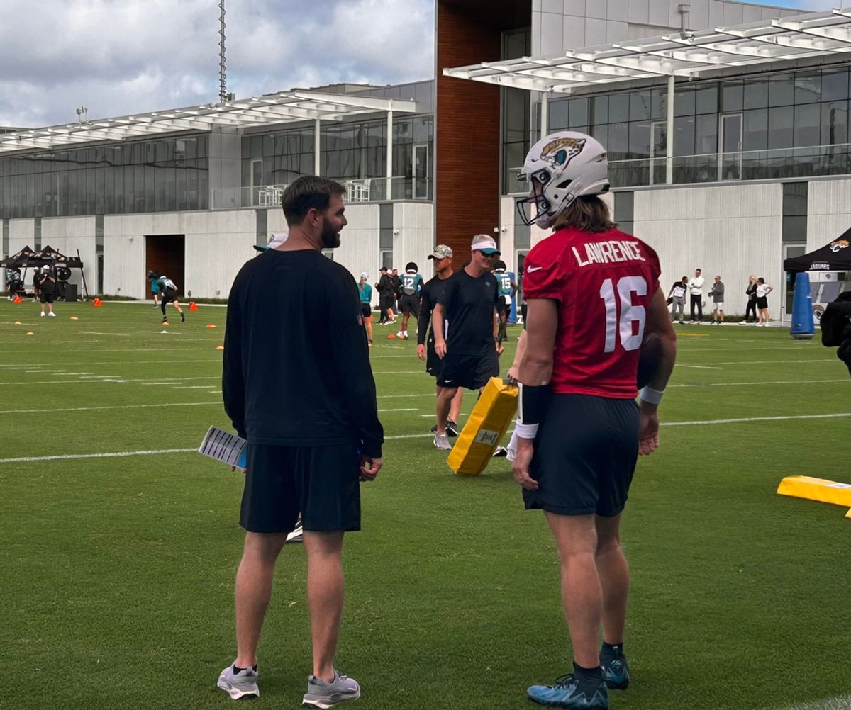 Jacksonville Jaguars quarterback Trevor Lawrence (16) talks with offensive coordinator Press Taylor during practice on Nov. 7 at the Miller Electric Center. Lawrence was limited for a second day in a row because of a left shoulder injury.