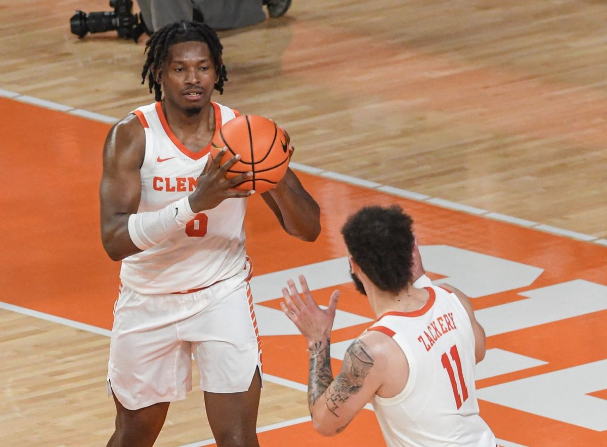 Clemson forward Myles Foster (6) passes to Clemson guard Jaeden Zachery (11) playing Charleston Southern University during the first half at Littlejohn Coliseum in Clemson, S.C Monday, November 4, 2024.