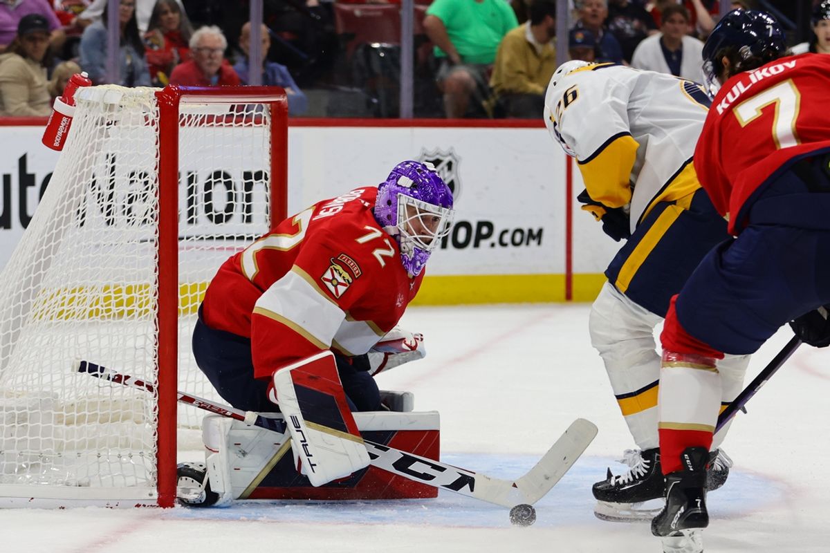 Nov 7, 2024; Sunrise, Florida, USA; Florida Panthers goaltender Sergei Bobrovsky (72) makes a save against Nashville Predators center Philip Tomasino (26) during the first period at Amerant Bank Arena. Mandatory Credit: Sam Navarro-Imagn Images