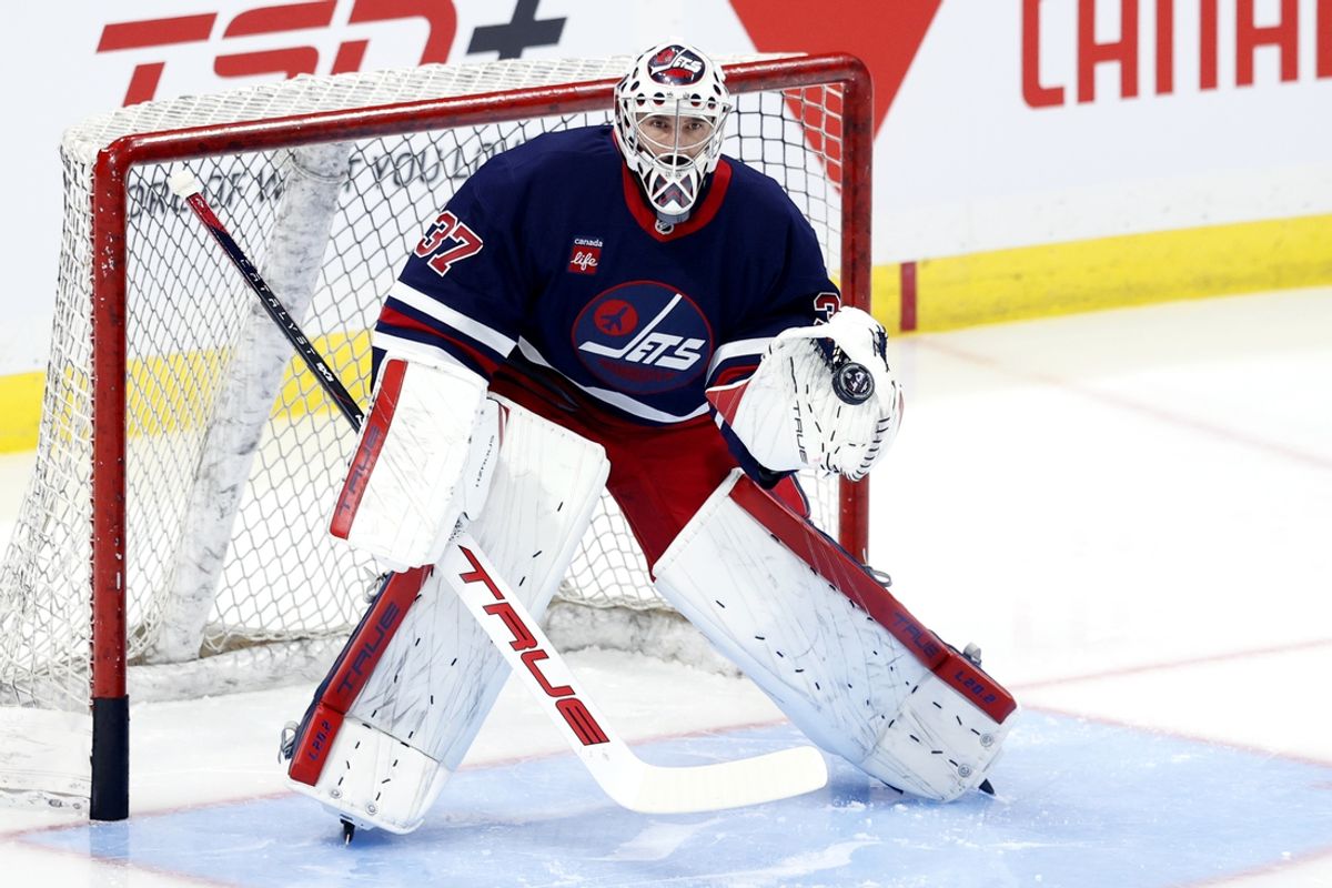 Nov 7, 2024; Winnipeg, Manitoba, CAN; Winnipeg Jets goaltender Connor Hellebuyck (37) warms up before a game against the Colorado Avalanche at Canada Life Centre. Mandatory Credit: James Carey Lauder-Imagn Images