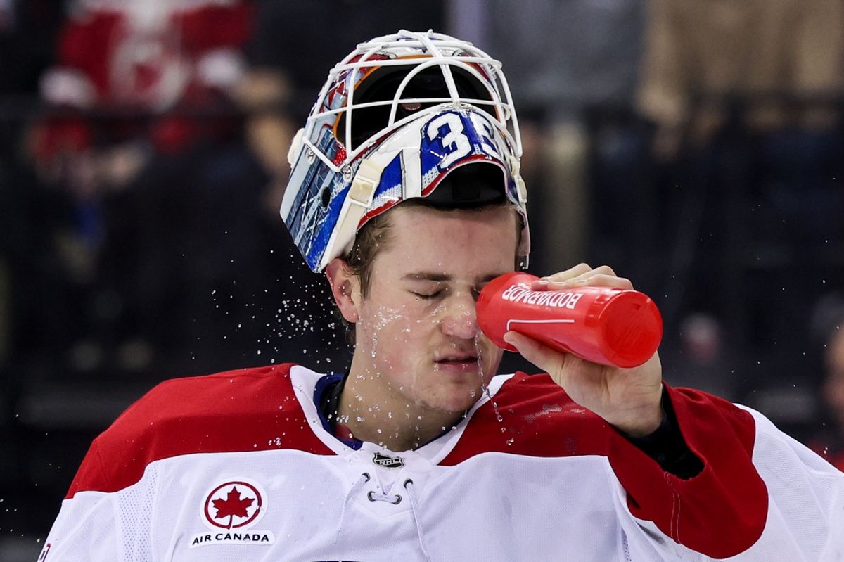 Nov 7, 2024; Newark, New Jersey, USA; Montreal Canadiens goaltender Sam Montembeault (35) sprays water during an intermission against the New Jersey Devils during the second period at Prudential Center. Mandatory Credit: Ed Mulholland-Imagn Images