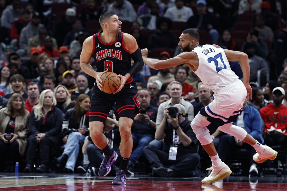 Nov 7, 2024; Chicago, Illinois, USA; Minnesota Timberwolves center Rudy Gobert (27) defends against Chicago Bulls center Nikola Vucevic (9) during the first half at United Center. Mandatory Credit: Kamil Krzaczynski-Imagn Images
