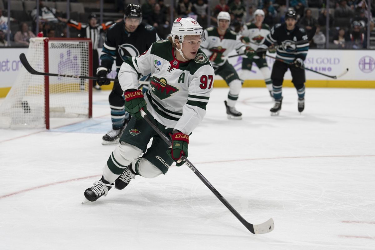Nov 7, 2024; San Jose, California, USA;  Minnesota Wild left wing Kirill Kaprizov (97) chase after the puck during the first period against the San Jose Sharks at SAP Center at San Jose. Mandatory Credit: Stan Szeto-Imagn Images