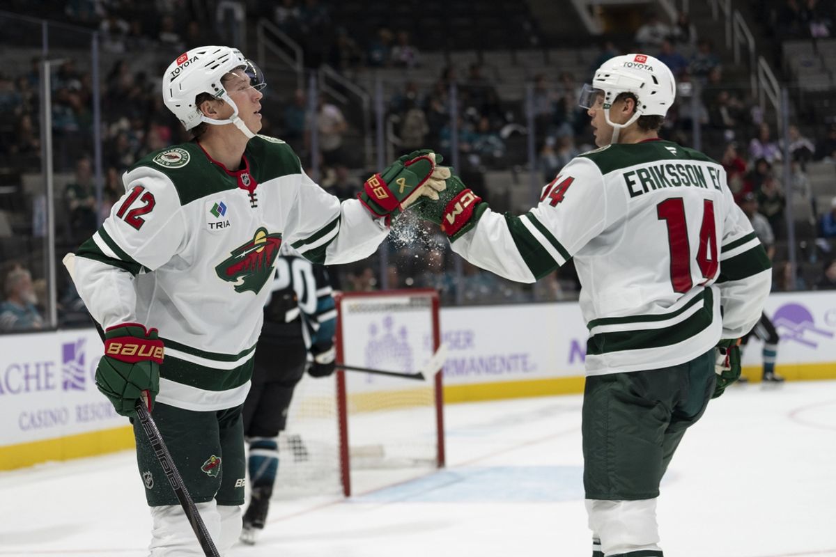 Nov 7, 2024; San Jose, California, USA;  Minnesota Wild left wing Matt Boldy (12) celebrates with center Joel Eriksson Ek (14) during the third period against the San Jose Sharks at SAP Center at San Jose. Mandatory Credit: Stan Szeto-Imagn Images