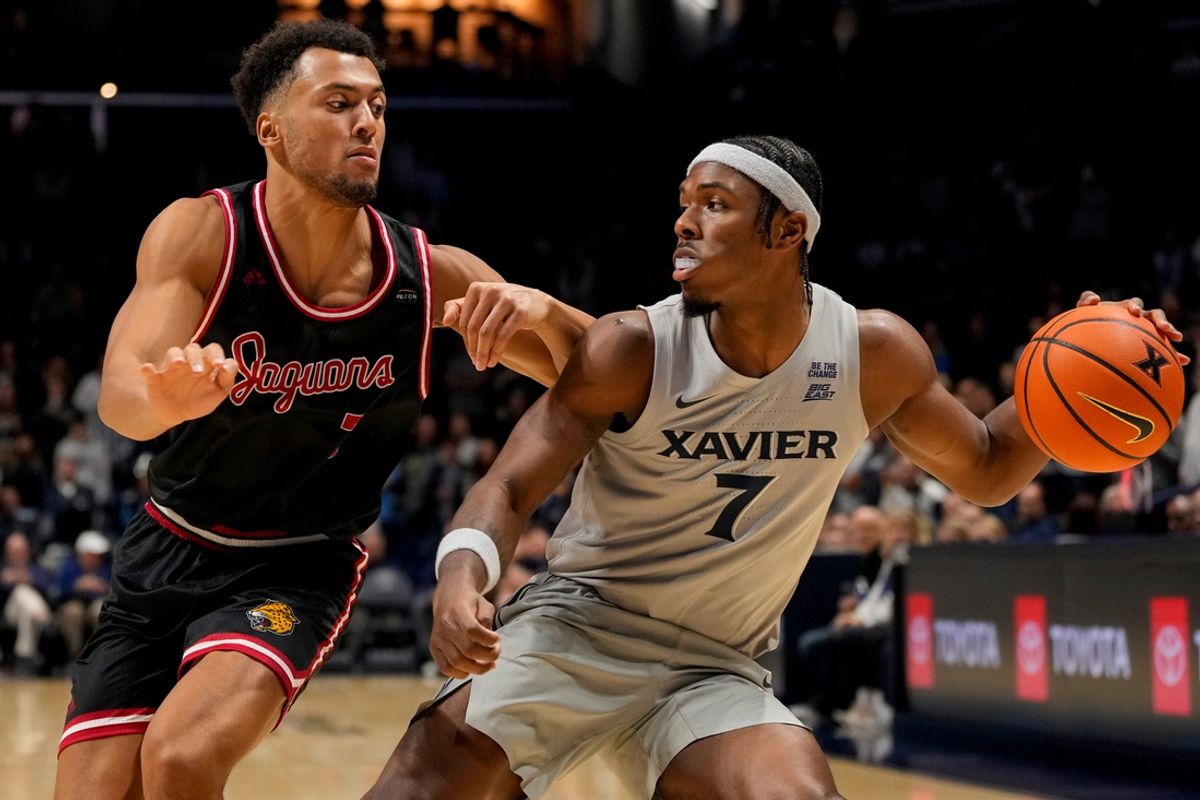 Xavier Musketeers guard Ryan Conwell (7) drives against IUPUI Jaguars forward Sean Craig (7) in the first half of the NCAA Men’s basketball game between the Xavier Musketeers and the IUPUI Jaguars at the Cintas Center at Xavier University in Cincinnati on Friday, Nov. 8, 2024.