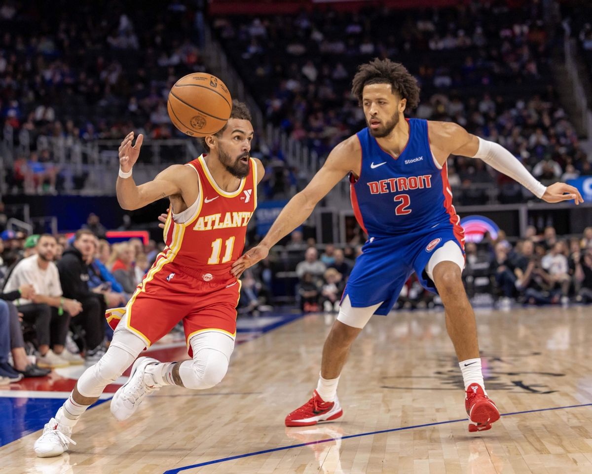 Nov 8, 2024; Detroit, Michigan, USA; Atlanta Hawks guard Trae Young (11) drives to the basket as Detroit Pistons guard Cade Cunningham (2) defends during the in the first half at Little Caesars Arena. Mandatory Credit: David Reginek-Imagn Images