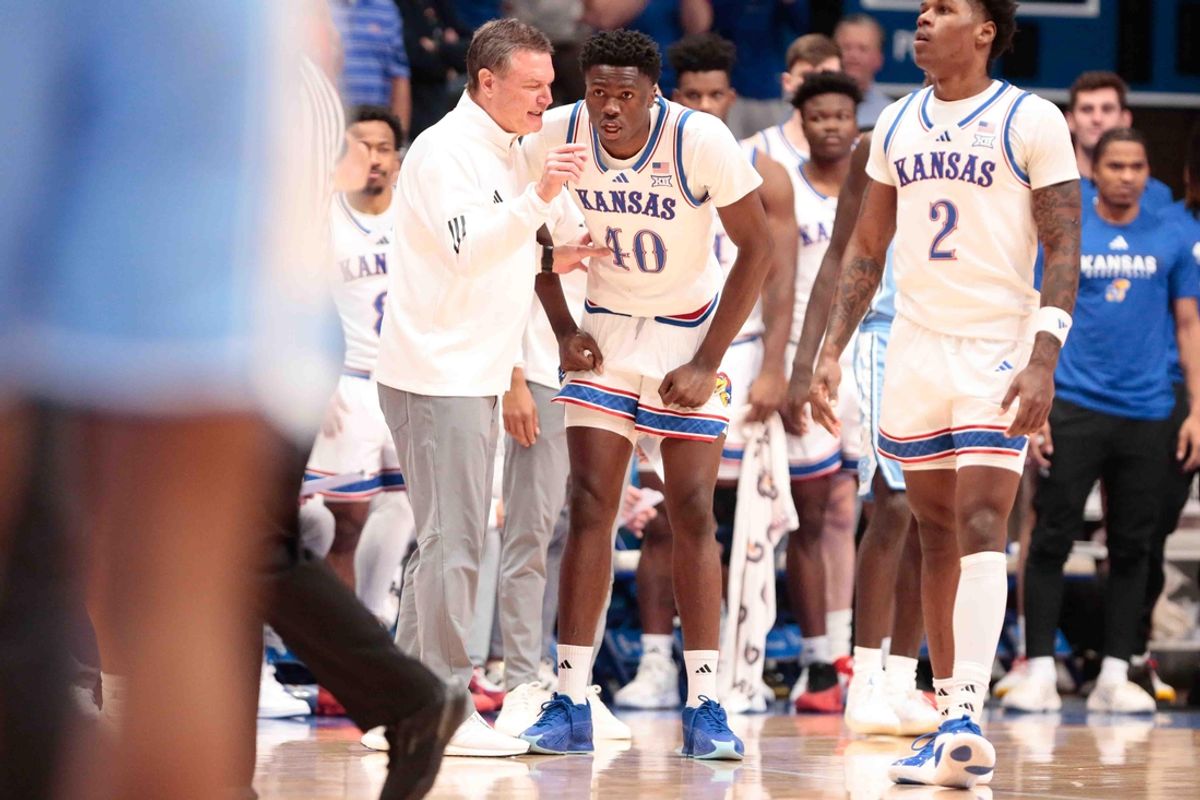 Kansas Jayhawks head coach Bill Self talks with Kansas Jayhawks forward Flory Bidunga (40) in the first half of the game against North Carolina Tar Heels inside Allen Fieldhouse Friday, Nov. 8, 2024.