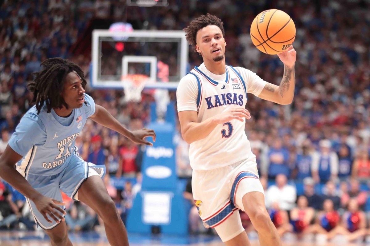 Kansas Jayhawks guard Zeke Mayo (5) dribbles the ball against North Carolina Tar Heels guard Ian Jackson (11) in the first half of the game inside Allen Fieldhouse Friday, Nov. 8, 2024.