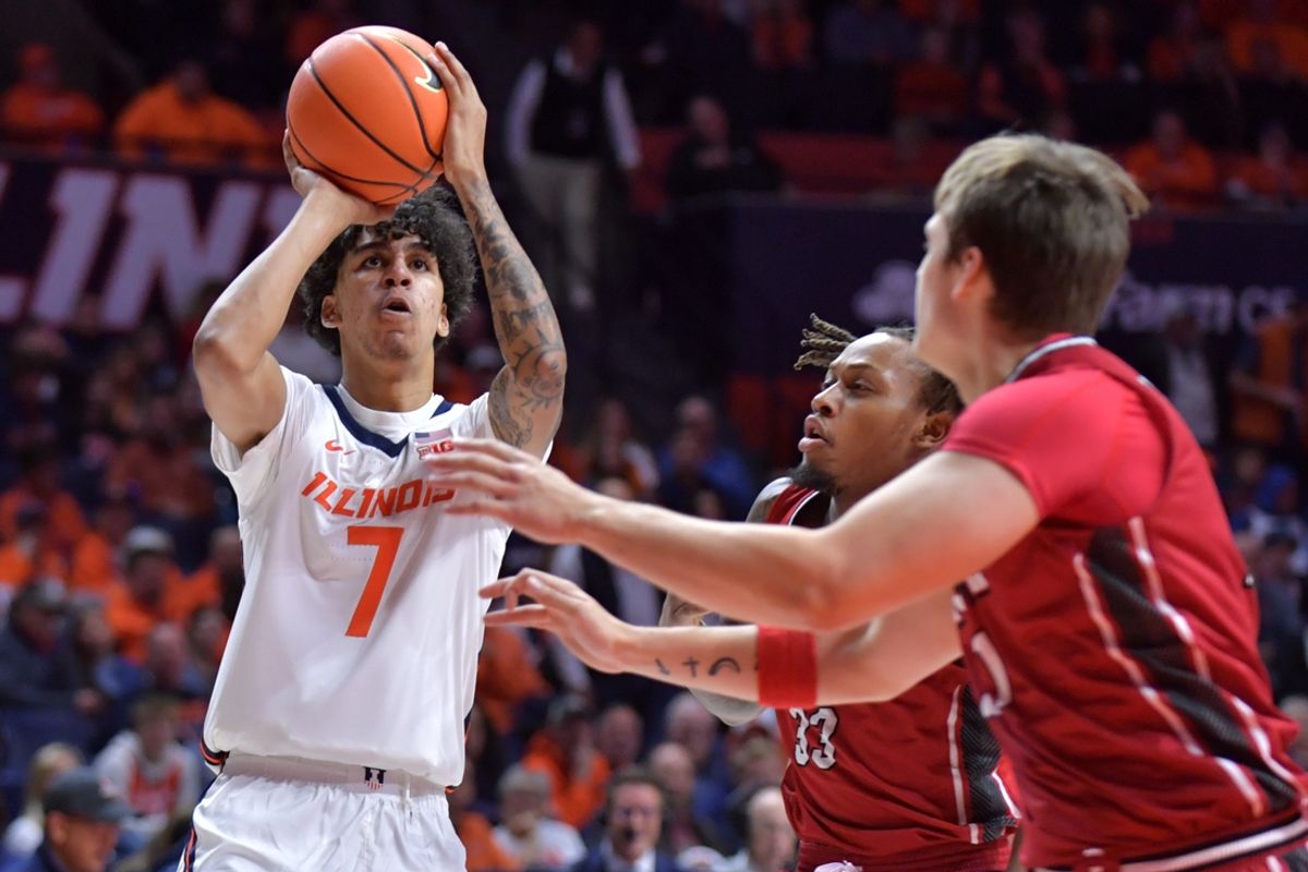 Nov 8, 2024; Champaign, Illinois, USA;  Illinois Fighting Illini forward Will Riley (7) shoots the ball over SIU Edwardsville Cougars forward Jo Valrie (33) during the first half at State Farm Center. Mandatory Credit: Ron Johnson-Imagn Images