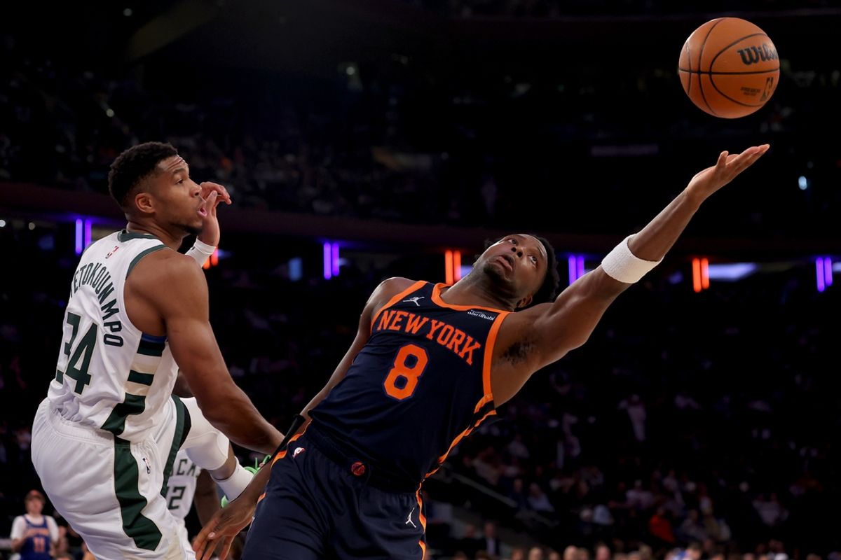 Nov 8, 2024; New York, New York, USA; New York Knicks forward OG Anunoby (8) fights for a rebound against Milwaukee Bucks forward Giannis Antetokounmpo (34) during the third quarter at Madison Square Garden. Mandatory Credit: Brad Penner-Imagn Images