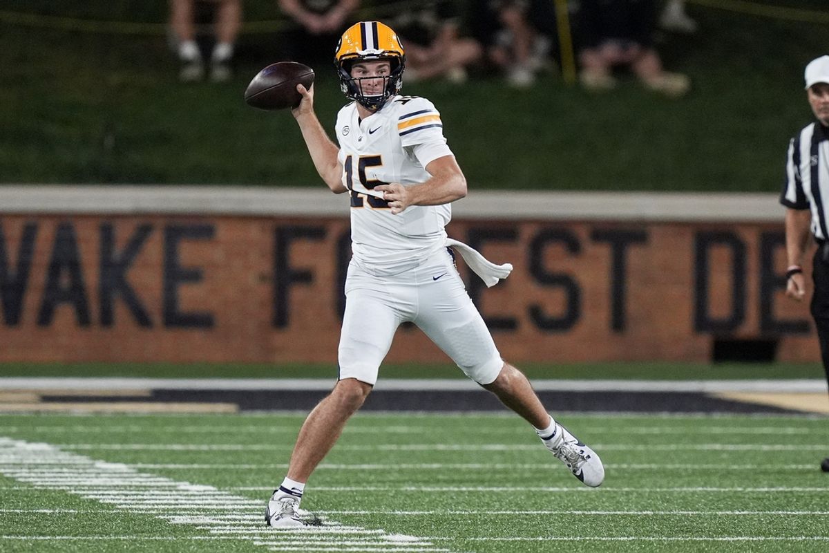 Nov 8, 2024; Winston-Salem, North Carolina, USA; California Golden Bears quarterback Fernando Mendoza (15) throws against the Wake Forest Demon Deacons during the first half at Allegacy Federal Credit Union Stadium. Mandatory Credit: Jim Dedmon-Imagn Images