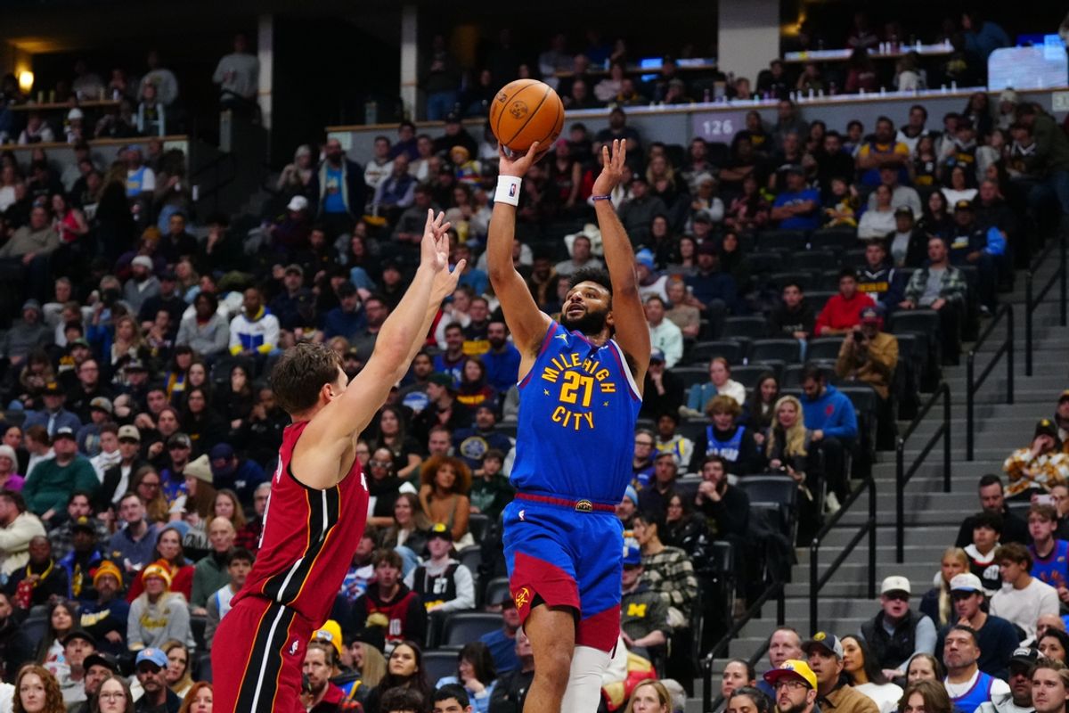 Nov 8, 2024; Denver, Colorado, USA; Denver Nuggets guard Jamal Murray (27) shoots the ball over Miami Heat guard Pelle Larsson (9) in the second quarter at Ball Arena. Mandatory Credit: Ron Chenoy-Imagn Images