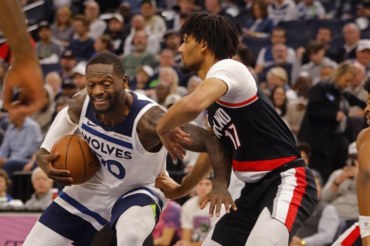 Nov 8, 2024; Minneapolis, Minnesota, USA; Minnesota Timberwolves forward Julius Randle (30) works against Portland Trail Blazers guard Shaedon Sharpe (17) in the second quarter at Target Center. Mandatory Credit: Bruce Kluckhohn-Imagn Images