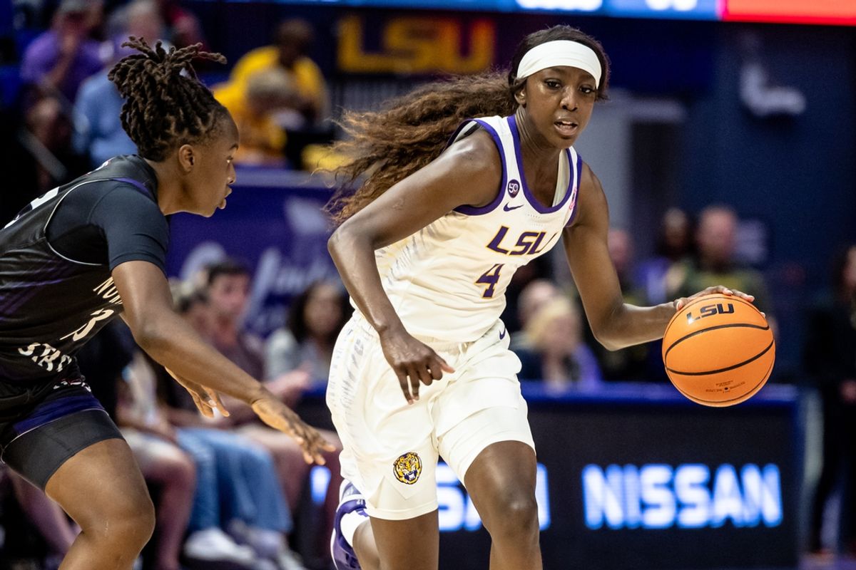 Nov 8, 2024; Baton Rouge, Louisiana, USA;  LSU Lady Tigers guard Flau'jae Johnson (4) dribbles against the Northwestern State Lady Demons during the first half at Pete Maravich Assembly Center. Mandatory Credit: Stephen Lew-Imagn Images