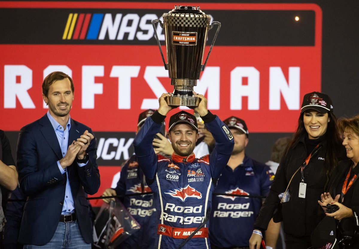 Nov 8, 2024; Avondale, Arizona, USA; NASCAR Truck Series driver Ty Majeski celebrates after winning the 2024 championship and the NASCAR Truck Series championship race at Phoenix Raceway. Mandatory Credit: Mark J. Rebilas-Imagn Images