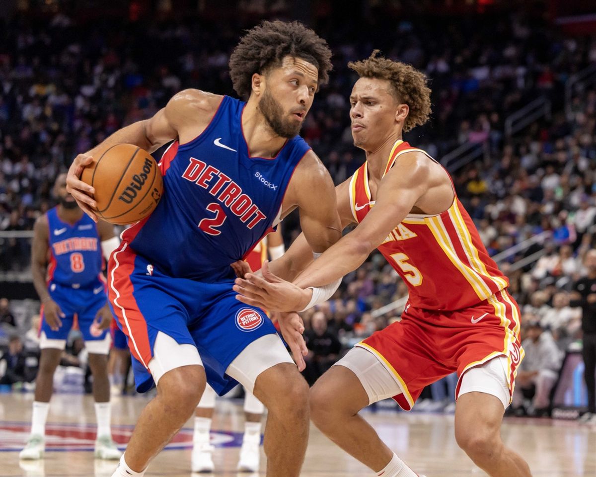 Nov 8, 2024; Detroit, Michigan, USA; Atlanta Hawks guard Dyson Daniels (5) defends against Detroit Pistons guard Cade Cunningham (2) during the second half at Little Caesars Arena. Mandatory Credit: David Reginek-Imagn Images