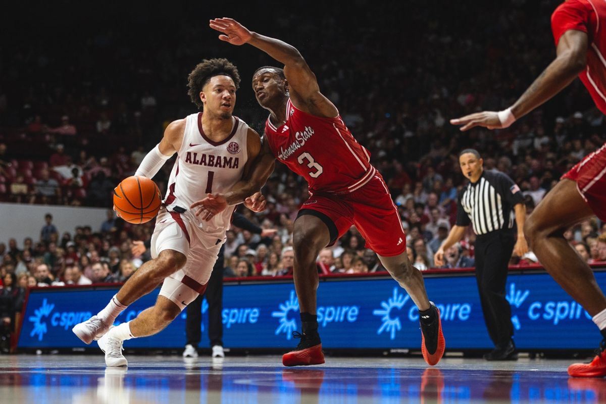Nov 8, 2024; Tuscaloosa, Alabama, USA; Alabama Crimson Tide guard Mark Sears (1) drives the ball against Arkansas State Red Wolves guard Derrian Ford (3) during the second half at Coleman Coliseum. Mandatory Credit: Will McLelland-Imagn Images