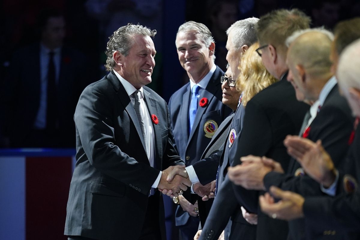 Nov 8, 2024; Toronto, Ontario, CAN; Class of 2024 Hockey Hall of Fame inductee Jeremy Roenick (left) is greeted by Hockey Hall of Fame members before a game against between the Detroit Red Wings and Toronto Maple Leafs during the first period at Scotiabank Arena. Mandatory Credit: John E. Sokolowski-Imagn Images