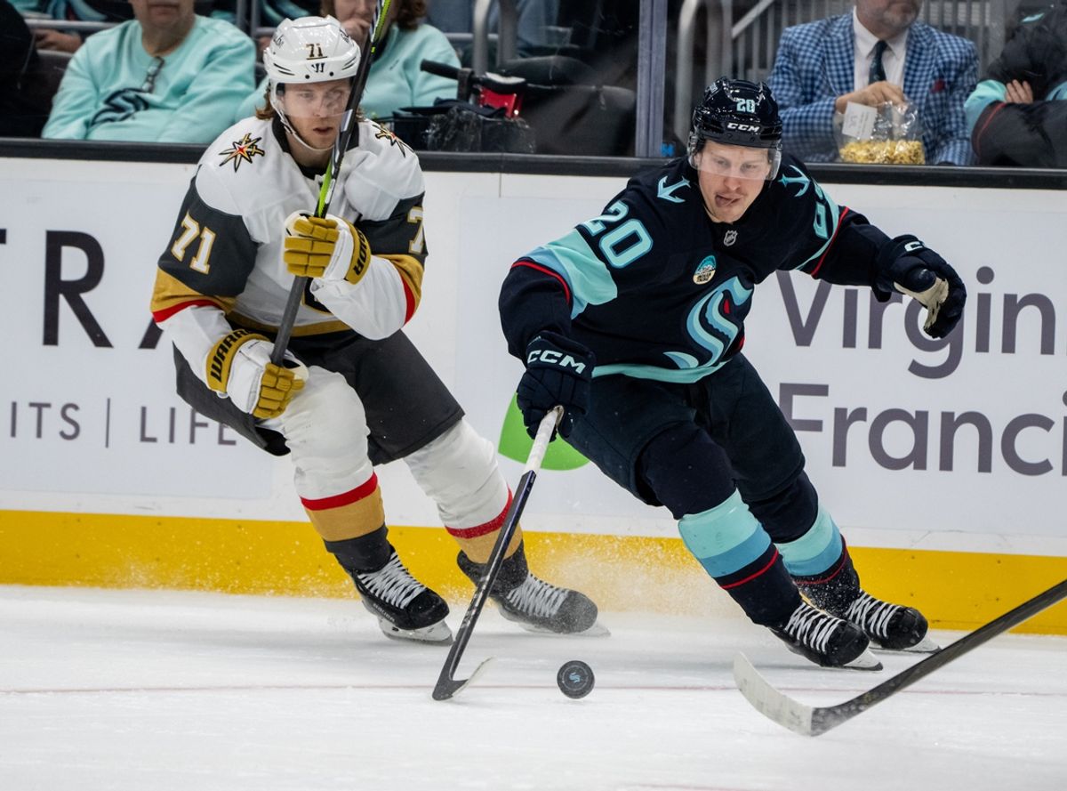 Nov 8, 2024; Seattle, Washington, USA;  Seattle Kraken forward Eeli Tolvanen (20) skates against Vegas Golden Knights forward William Karlsson (71) during the second period at Climate Pledge Arena. Mandatory Credit: Stephen Brashear-Imagn Images