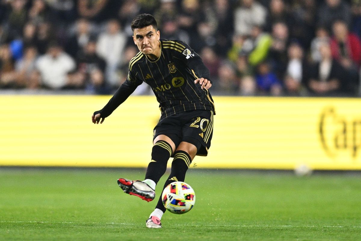 Nov 8, 2024; Los Angeles, California, USA; LAFC midfielder Eduard Atuesta (20) controls the ball against Vancouver Whitecaps FC in the second half in a 2024 MLS Cup Playoffs Round One match at BMO Stadium. Mandatory Credit: Kelvin Kuo-Imagn Images
