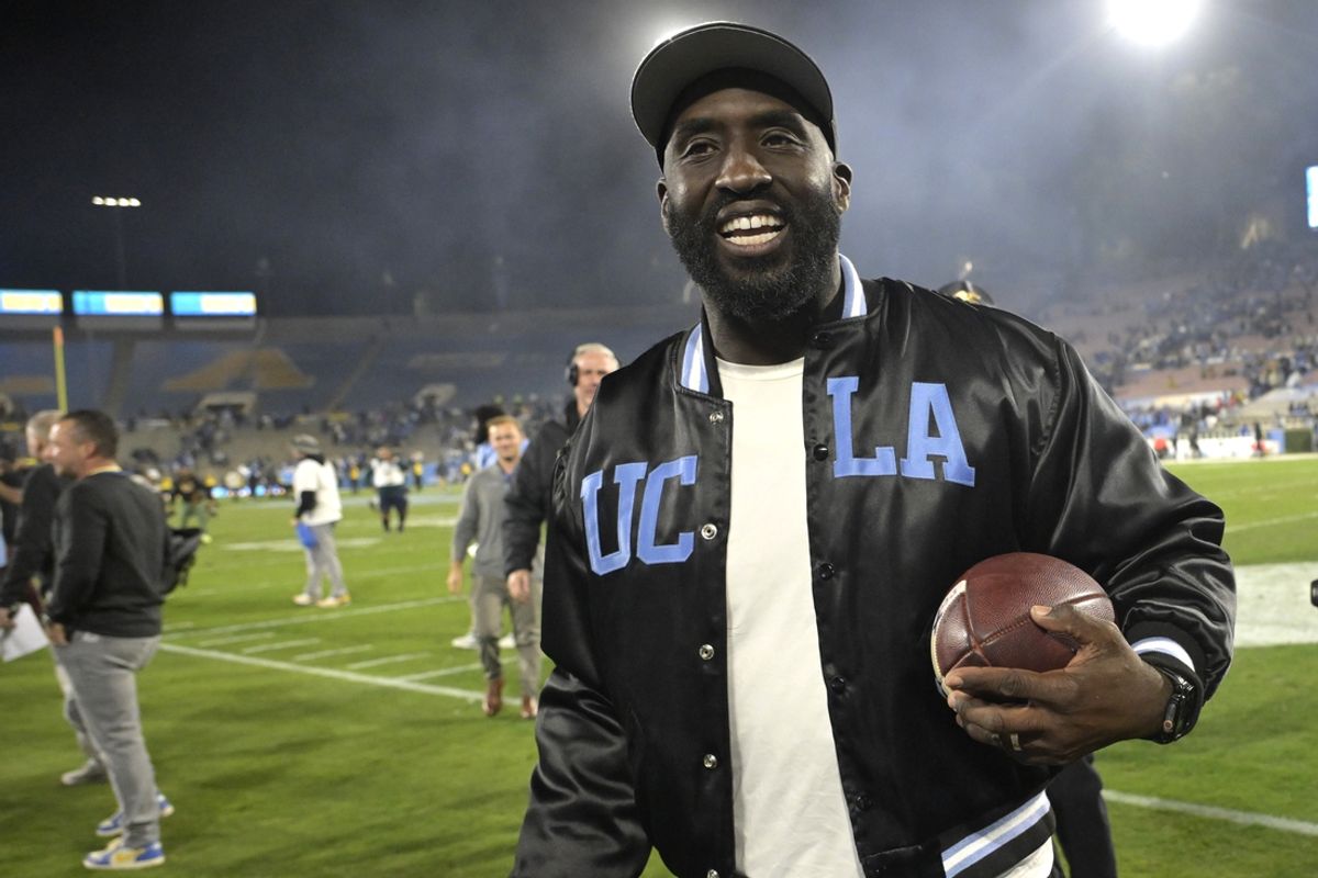 Nov 8, 2024; Pasadena, California, USA;  UCLA Bruins head coach DeShaun Foster leaves the field with the game ball after defeating the Iowa Hawkeyes at the Rose Bowl. Mandatory Credit: Jayne Kamin-Oncea-Imagn Images
