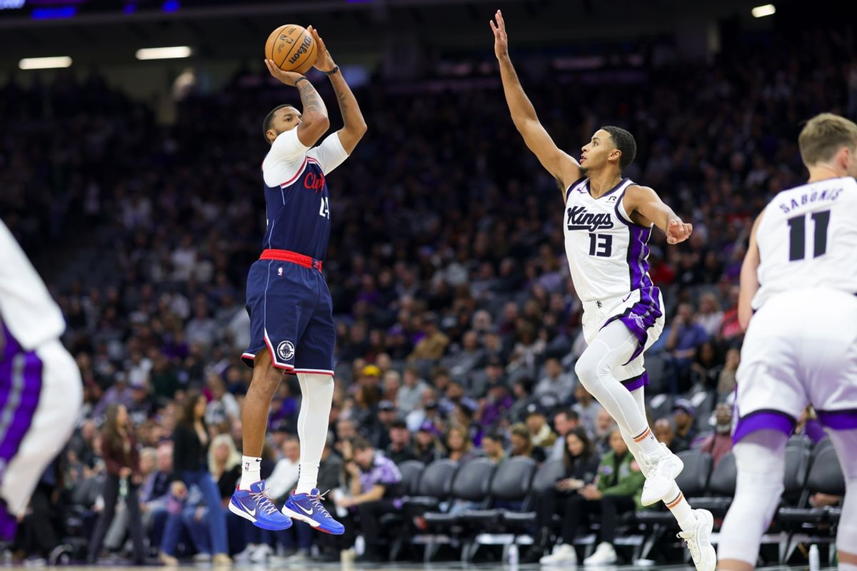 Nov 8, 2024; Sacramento, California, USA; Los Angeles Clippers guard Norman Powell (24) shoots against Sacramento Kings forward Keegan Murray (13) during the fourth quarter at Golden 1 Center. Mandatory Credit: Sergio Estrada-Imagn Images
