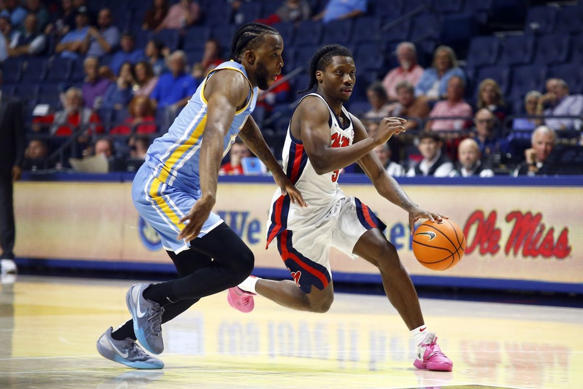 Nov 4, 2024; Oxford, Mississippi, USA; Mississippi Rebels guard Jaylen Murray (5) drives to the basket as Long Island Sharks guard Brent Davis (12) defends during the second half at The Sandy and John Black Pavilion at Ole Miss. Mandatory Credit: Petre Thomas-Imagn Images
