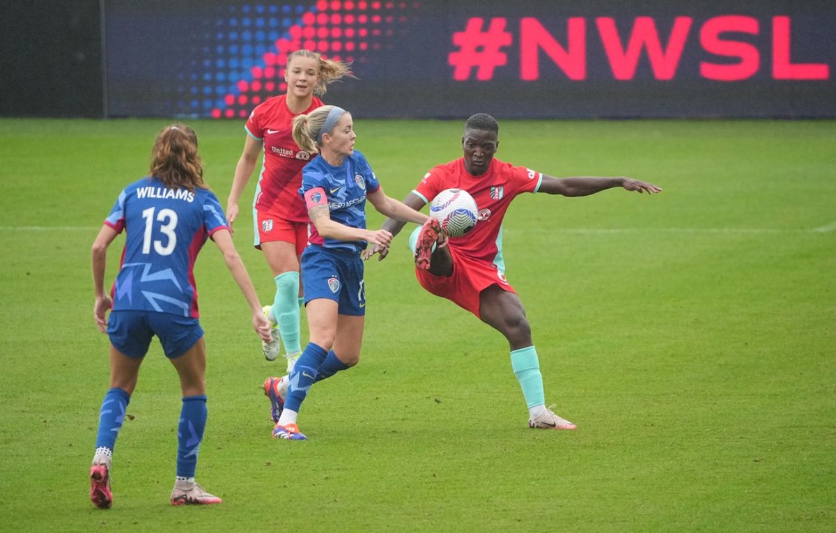 Nov 9, 2024; Kansas City, MO, USA; Kansas City Current forward Temwa Chawinga (6) and North Carolina Courage defender Felicitas Rauch (11) battle for the ball in a NWSL playoff match at CPKC Stadium. Mandatory Credit: Denny Medley-Imagn Images