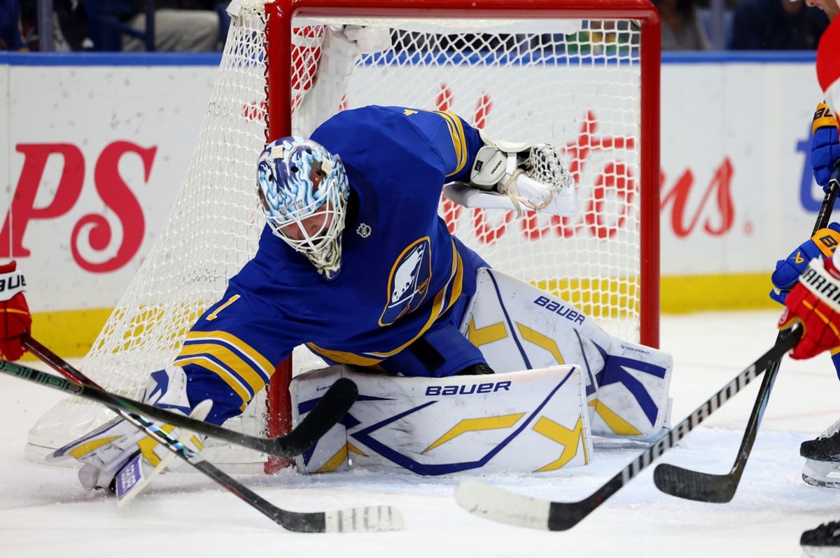 Nov 9, 2024; Buffalo, New York, USA;  Buffalo Sabres goaltender Ukko-Pekka Luukkonen (1) tries to cover up the puck during the first period against the Calgary Flames at KeyBank Center. Mandatory Credit: Timothy T. Ludwig-Imagn Images