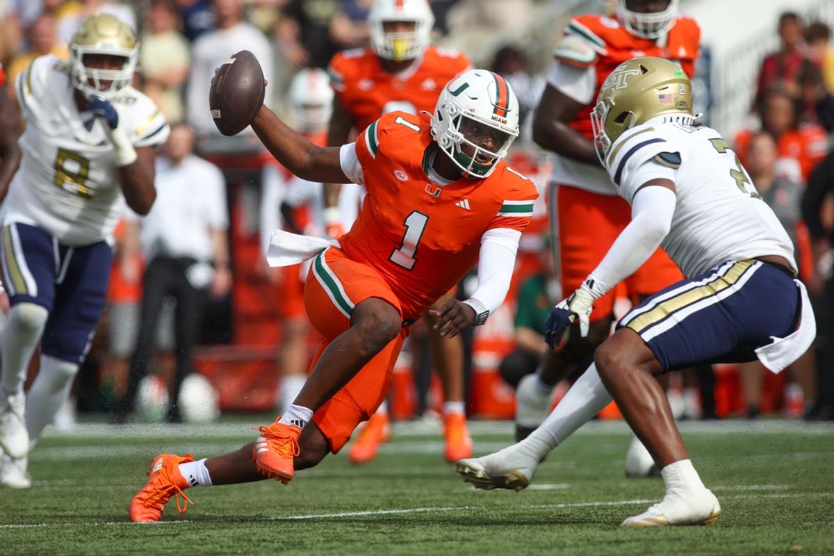 Nov 9, 2024; Atlanta, Georgia, USA; Miami Hurricanes quarterback Cam Ward (1) scrambles against the Georgia Tech Yellow Jackets in the second quarter at Bobby Dodd Stadium at Hyundai Field. Mandatory Credit: Brett Davis-Imagn Images