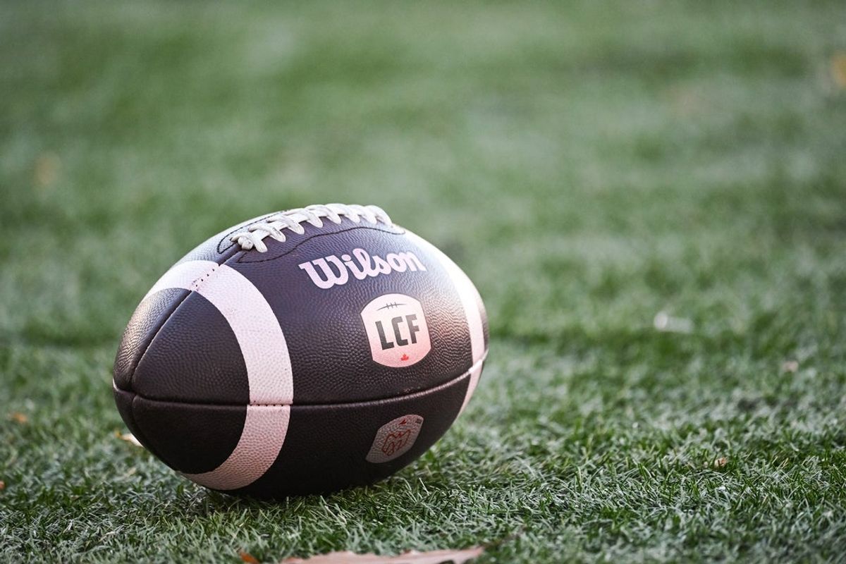Nov 9, 2024; Montreal, Quebec, CAN; View of a CFL game ball on the field with the french logo during warm-up before the game betweem Toronto Argonauts and Montreal Alouettes at Percival-Molson Memorial Stadium. Mandatory Credit: David Kirouac-Imagn Images