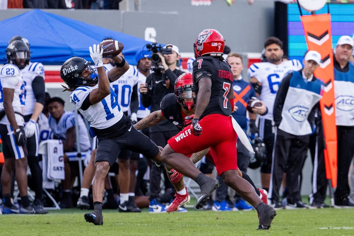 Nov 9, 2024; Raleigh, North Carolina, USA; Duke Blue Devils wide receiver Que'Sean Brown (14) makes the catch against the North Carolina State Wolfpack during the first half at Carter-Finley Stadium. Mandatory Credit: Scott Kinser/USA TODAY Network via Imagn Images